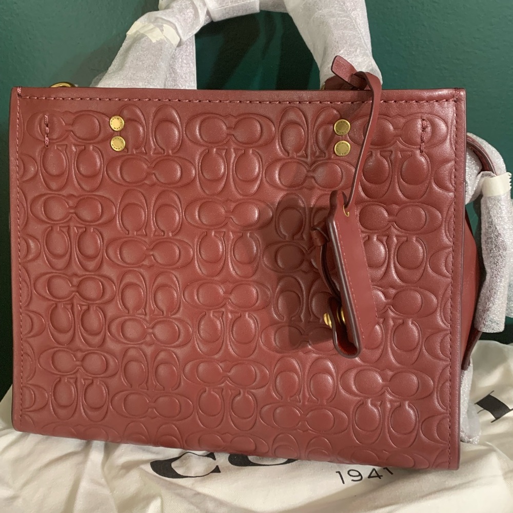 Coach NWT signature embossed rogue
